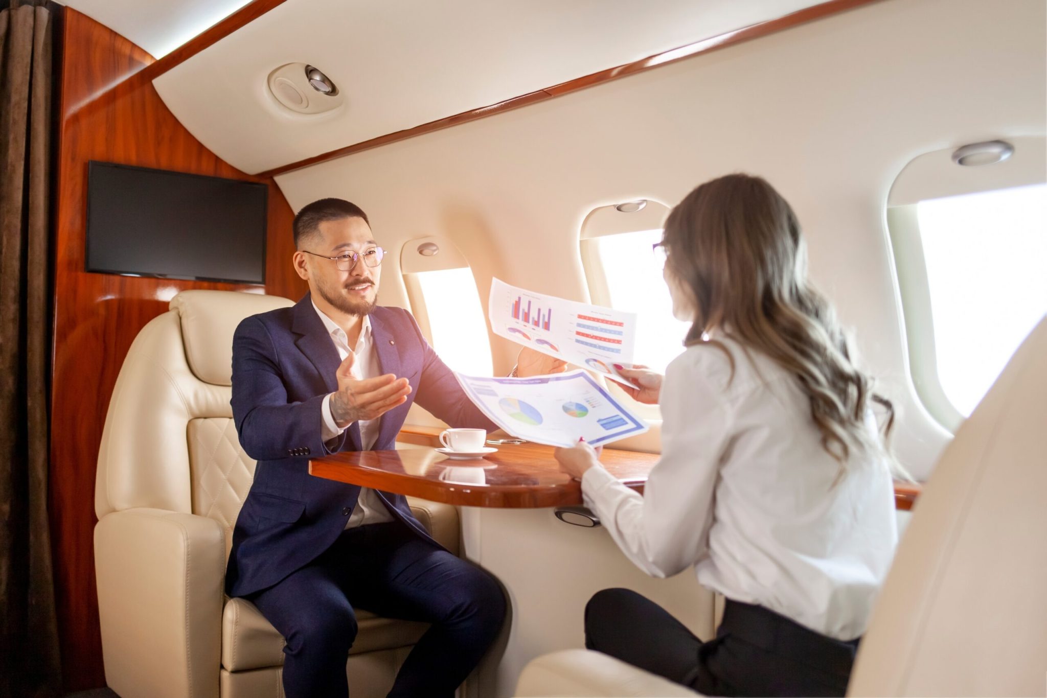 Business meeting in jet cabin [Shutterstock]