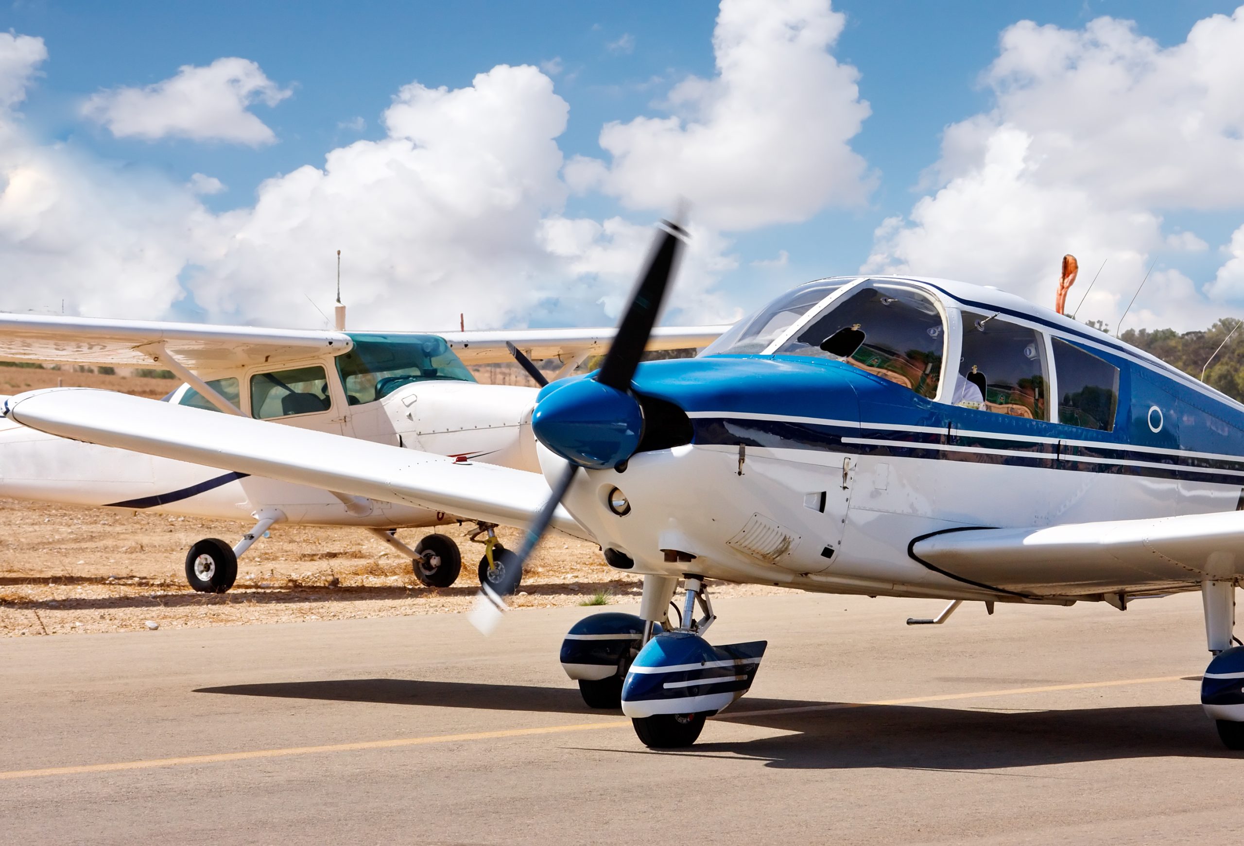 Single-engine piston aircraft parked at a small airfield