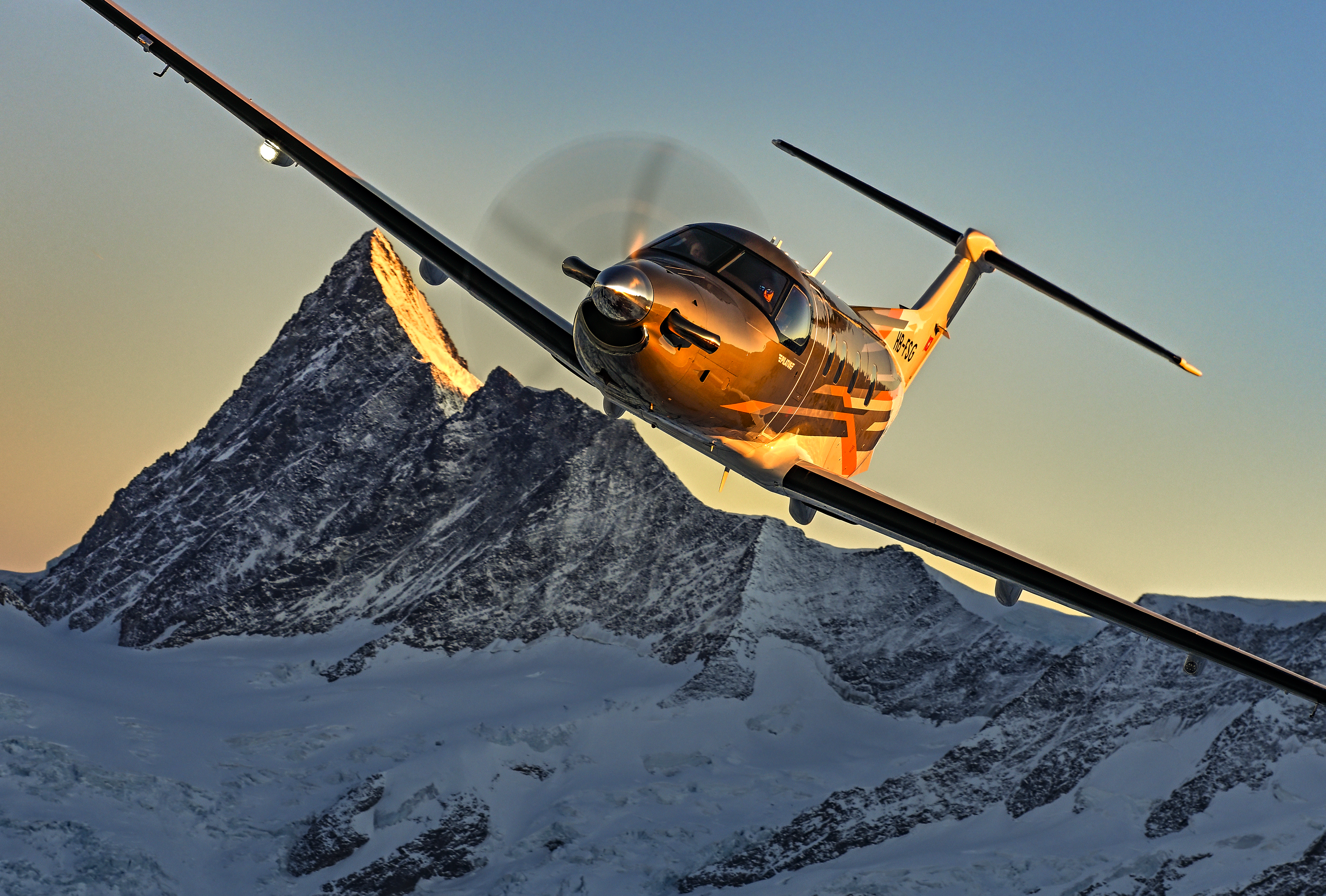 Pilatus PC-12 PRO in flight over the Swiss Alps — turboprop financing by FLYING Finance