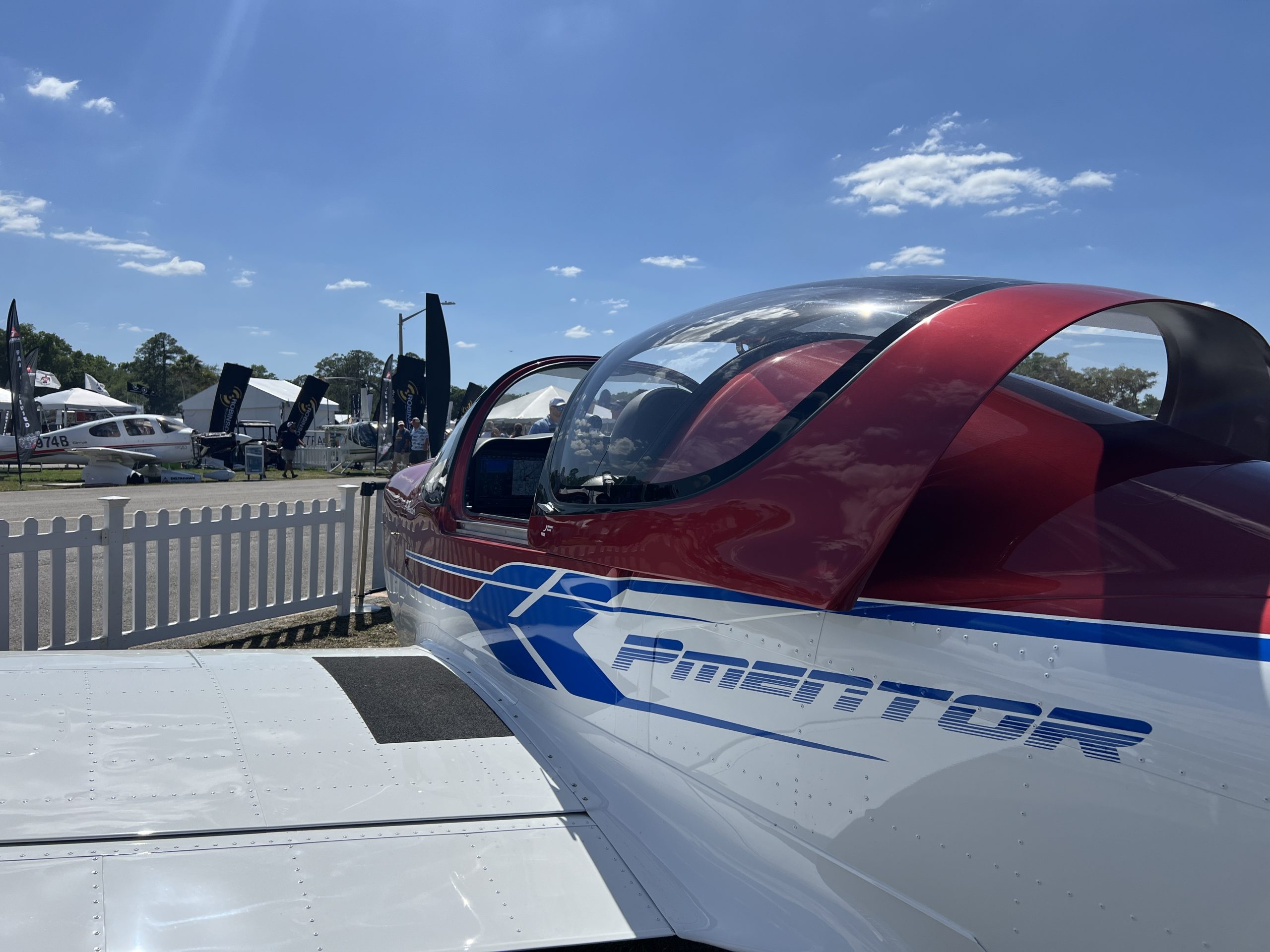 A modern light sport trainer aircraft on display at an airshow